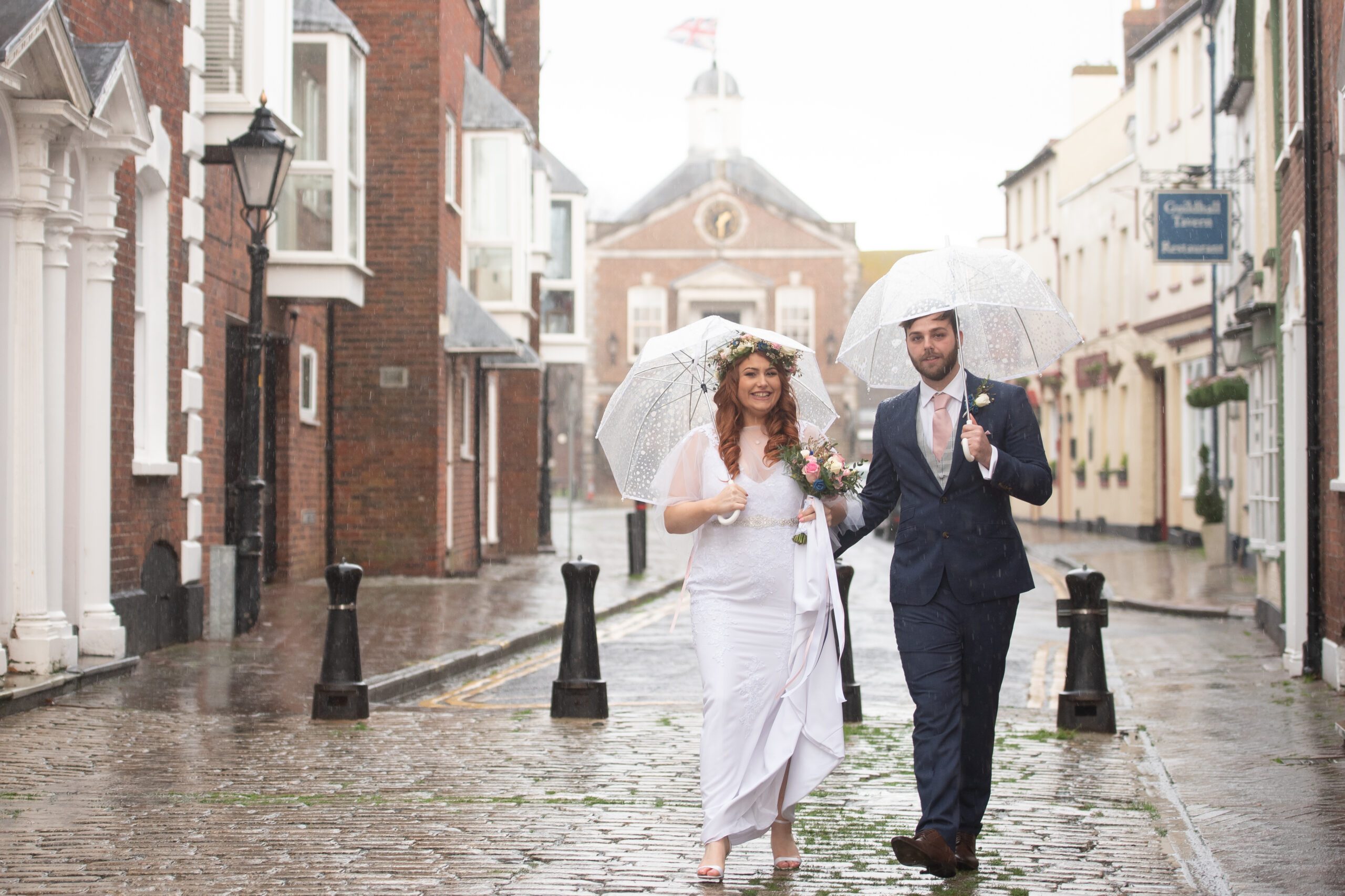 wet wedding couple at Poole registry office wedding